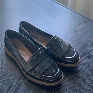 Clark’s loathed patent leather black